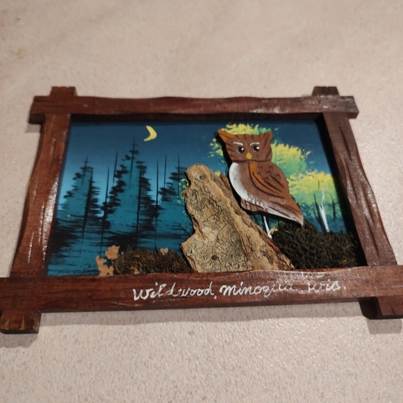 Vintage wooden frame with carved artwork is a unique addition to any collection